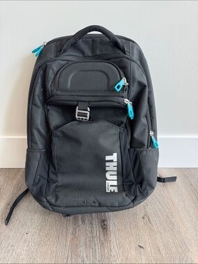 Thule Black Backpack with Teal Zipper Accents - Men Bags